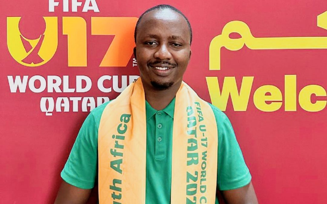 SMU alumnus Kenny Mziyako flies the South African flag at the 2025 FIFA U-17 World Cup